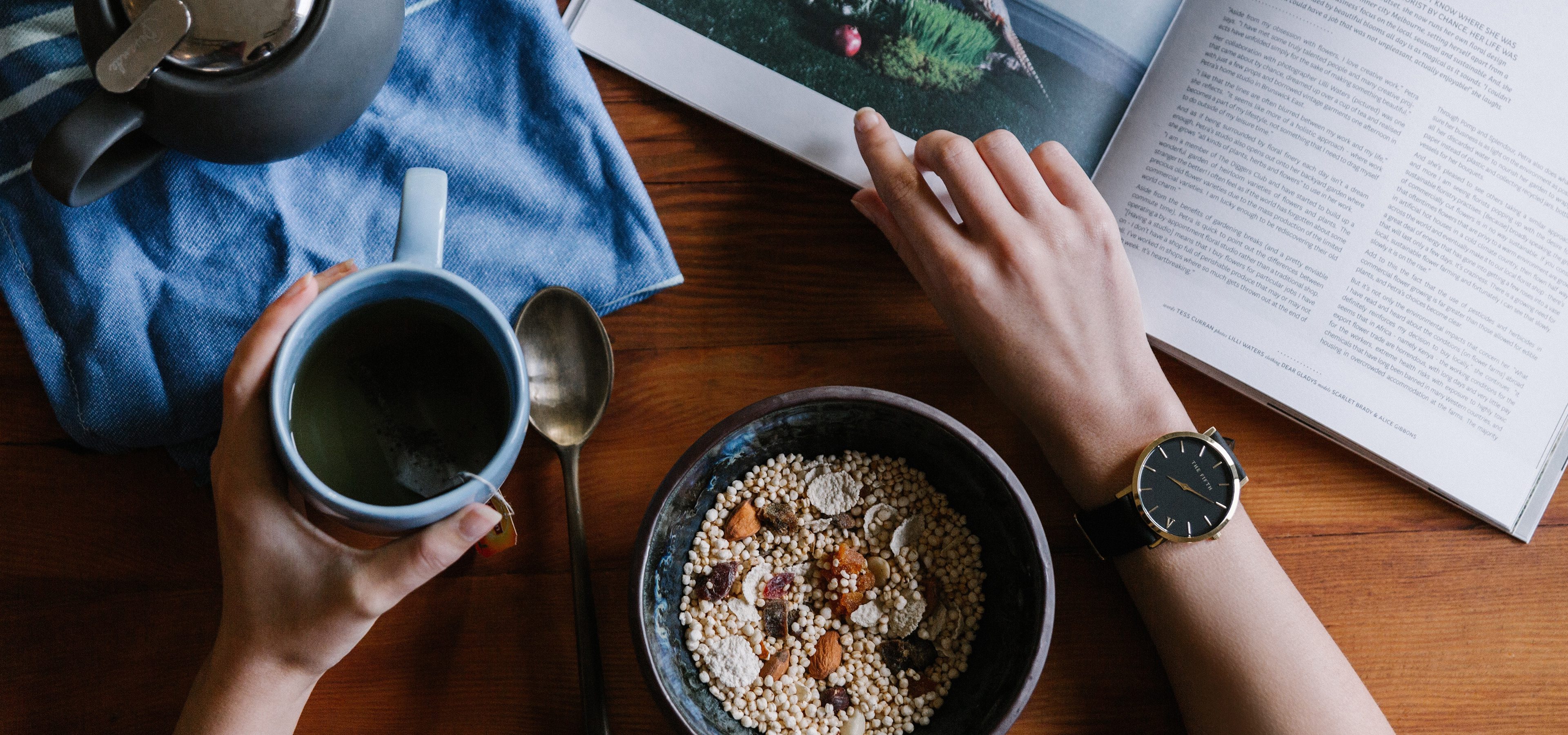 Reading a book whilst eating breakfast