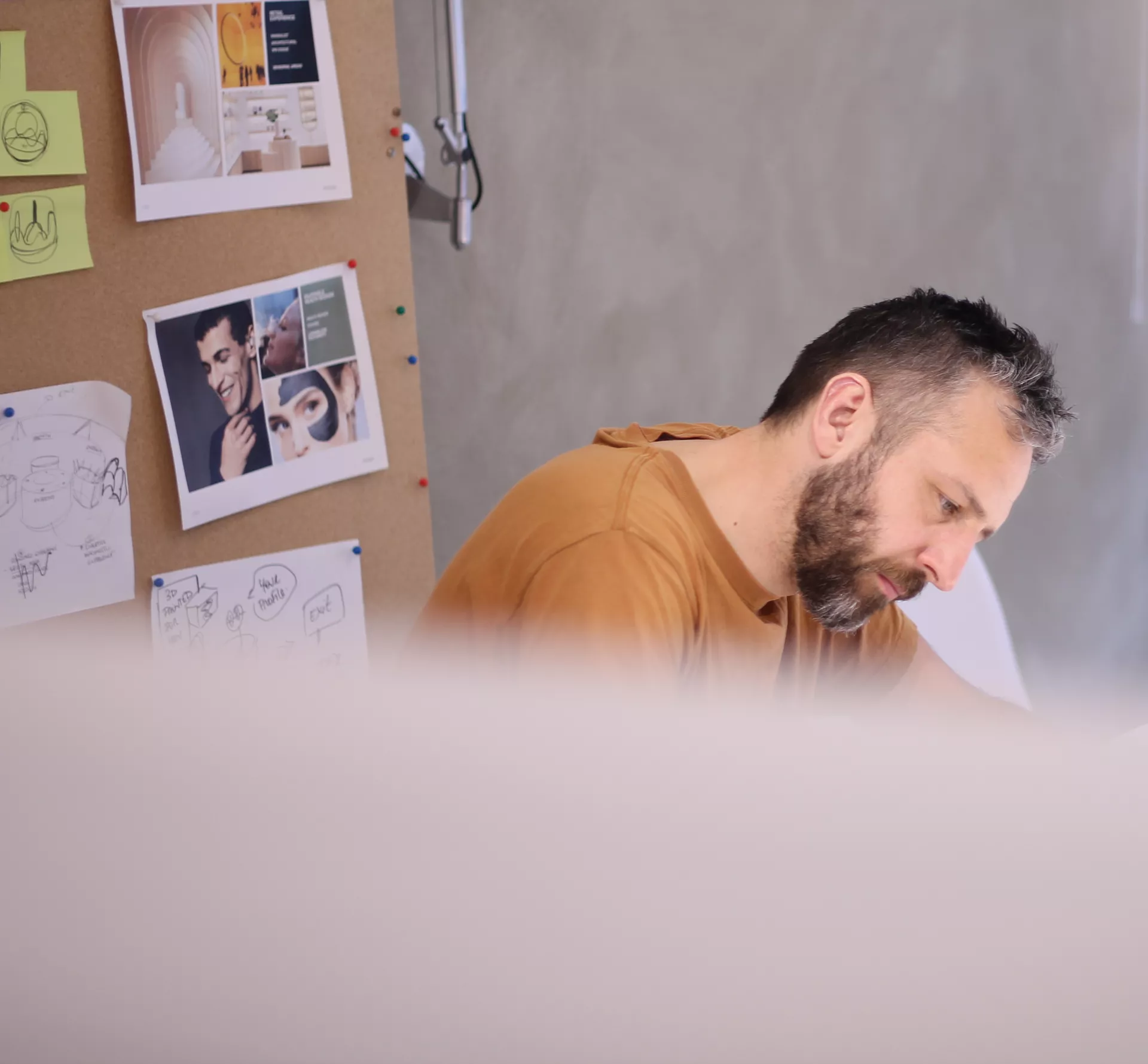 Mark Morgan director at Rodd design sketching in the studio