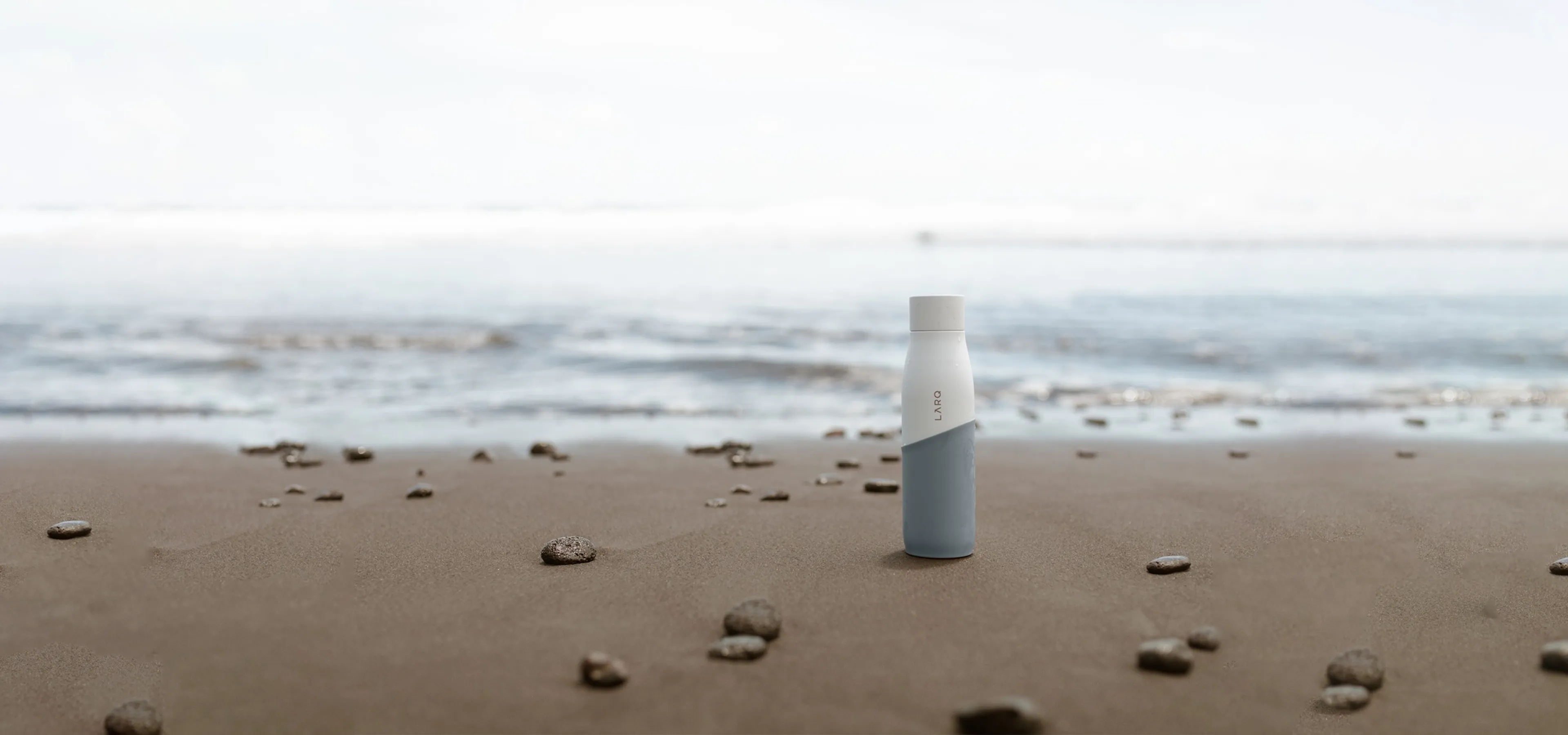 Earthific - Larq bottle at the shores edge