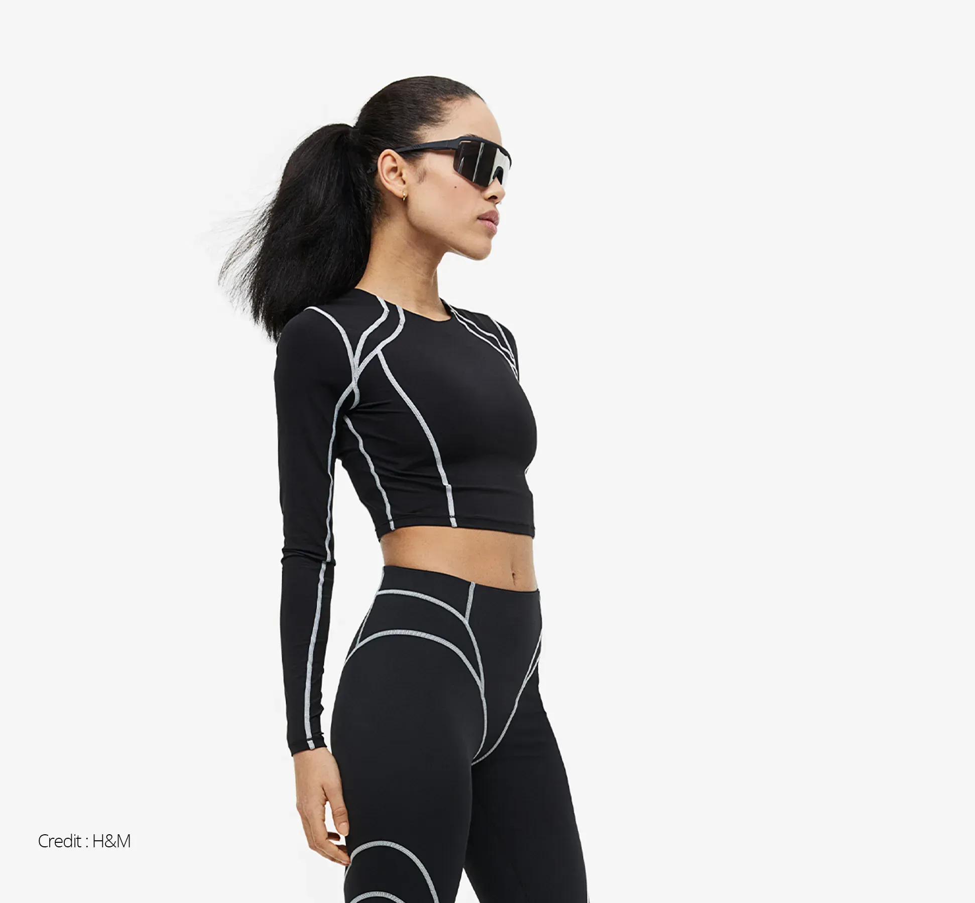Woman in black sportswear - H&M have partnered with Lanzatech to reduce their carbon foortprint