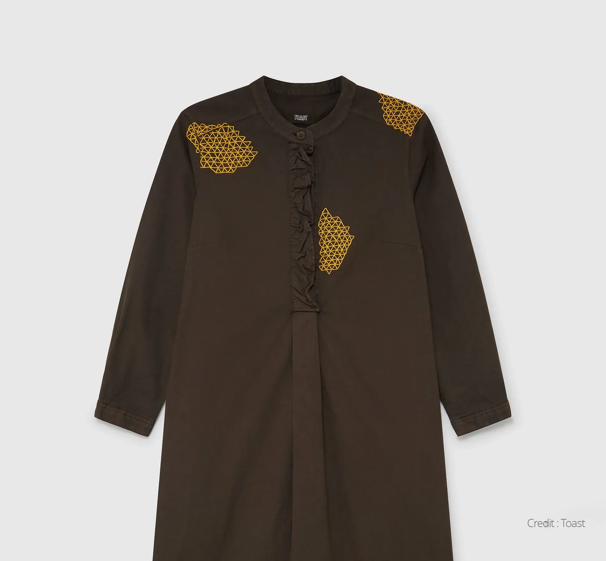 Brown smock with gold repair stitching