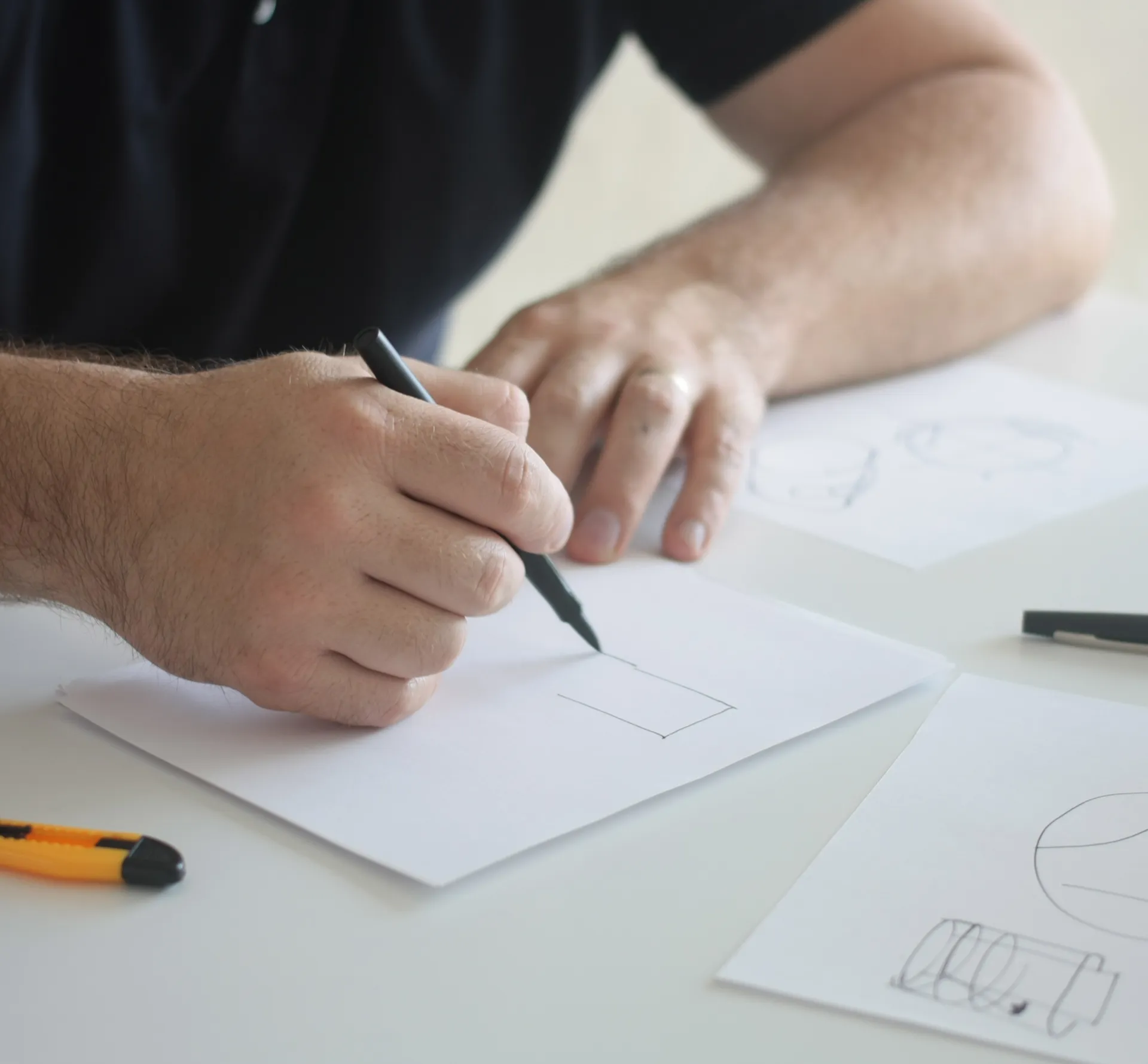 Ben from Rodd sketching at a table