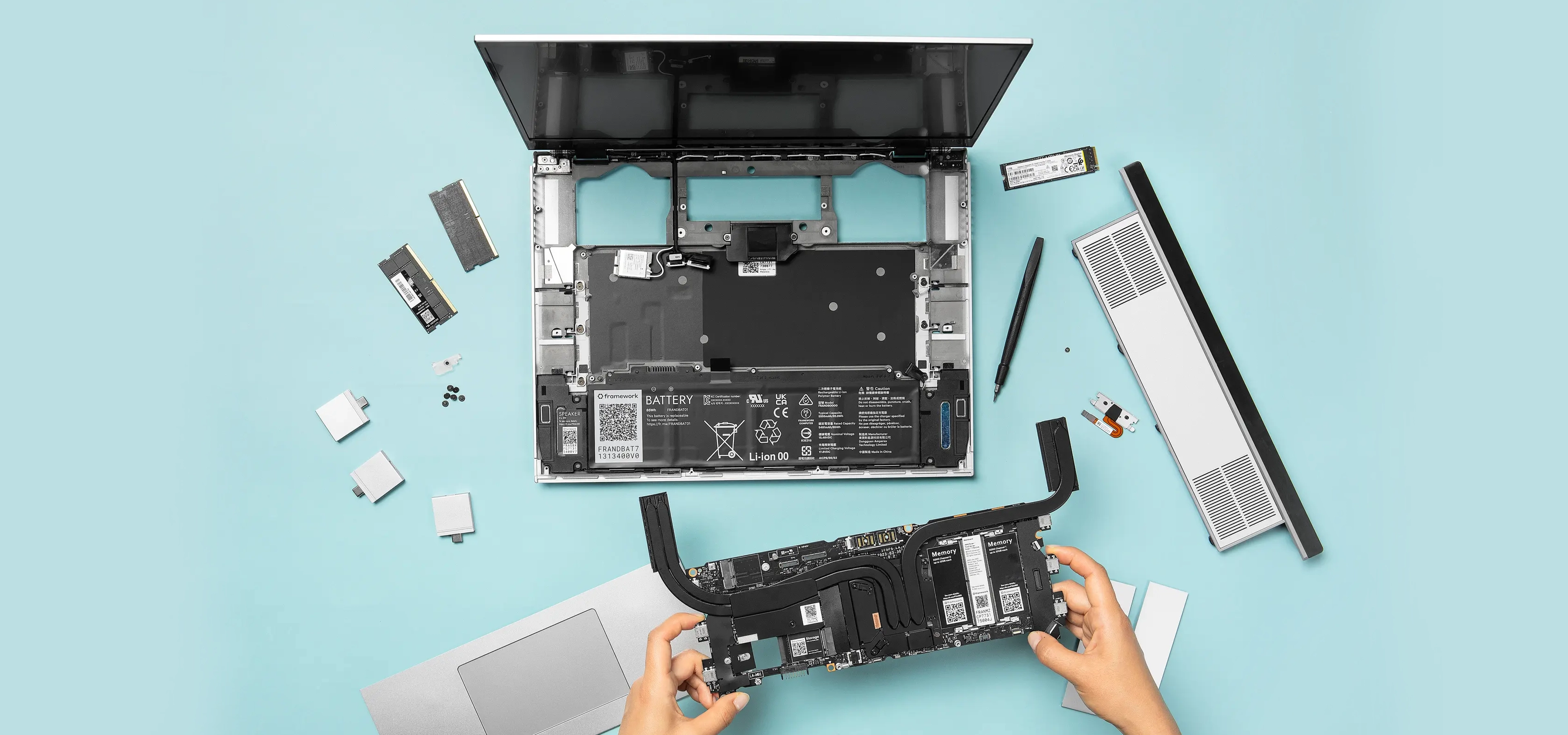 Someone disassembling a Framework laptop