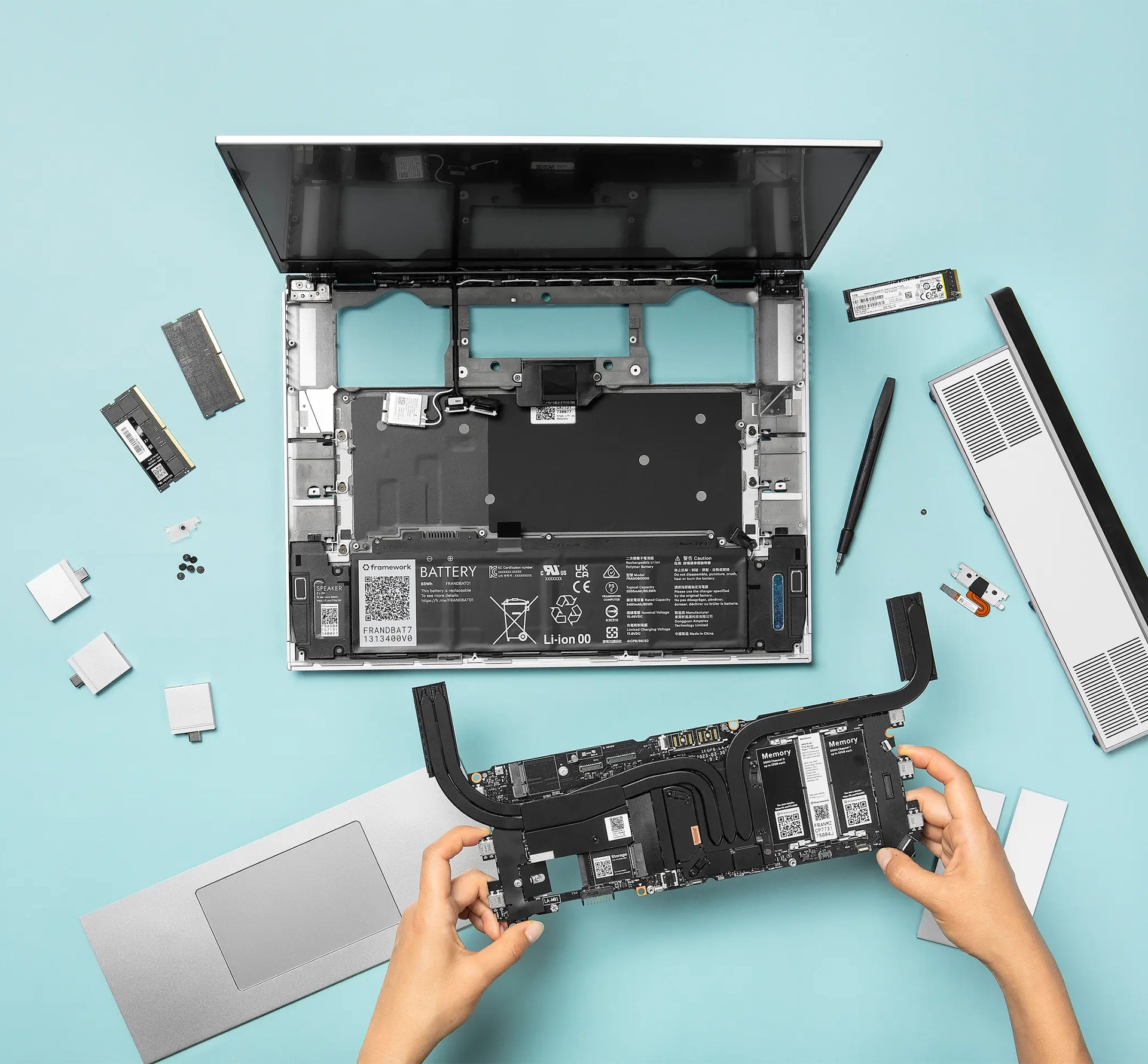 Someone disassembling a Framework laptop