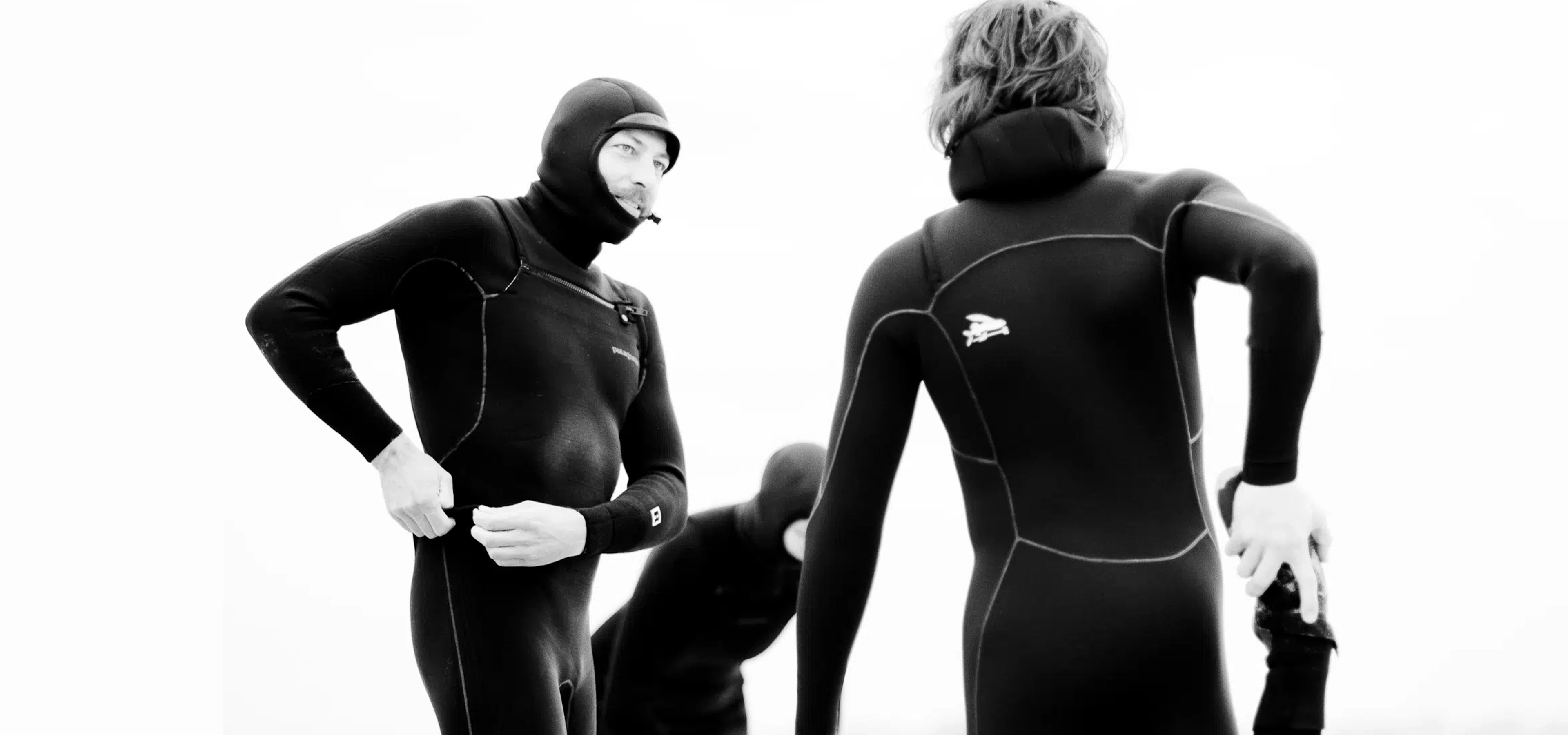 people wearing patagonia wetsuits