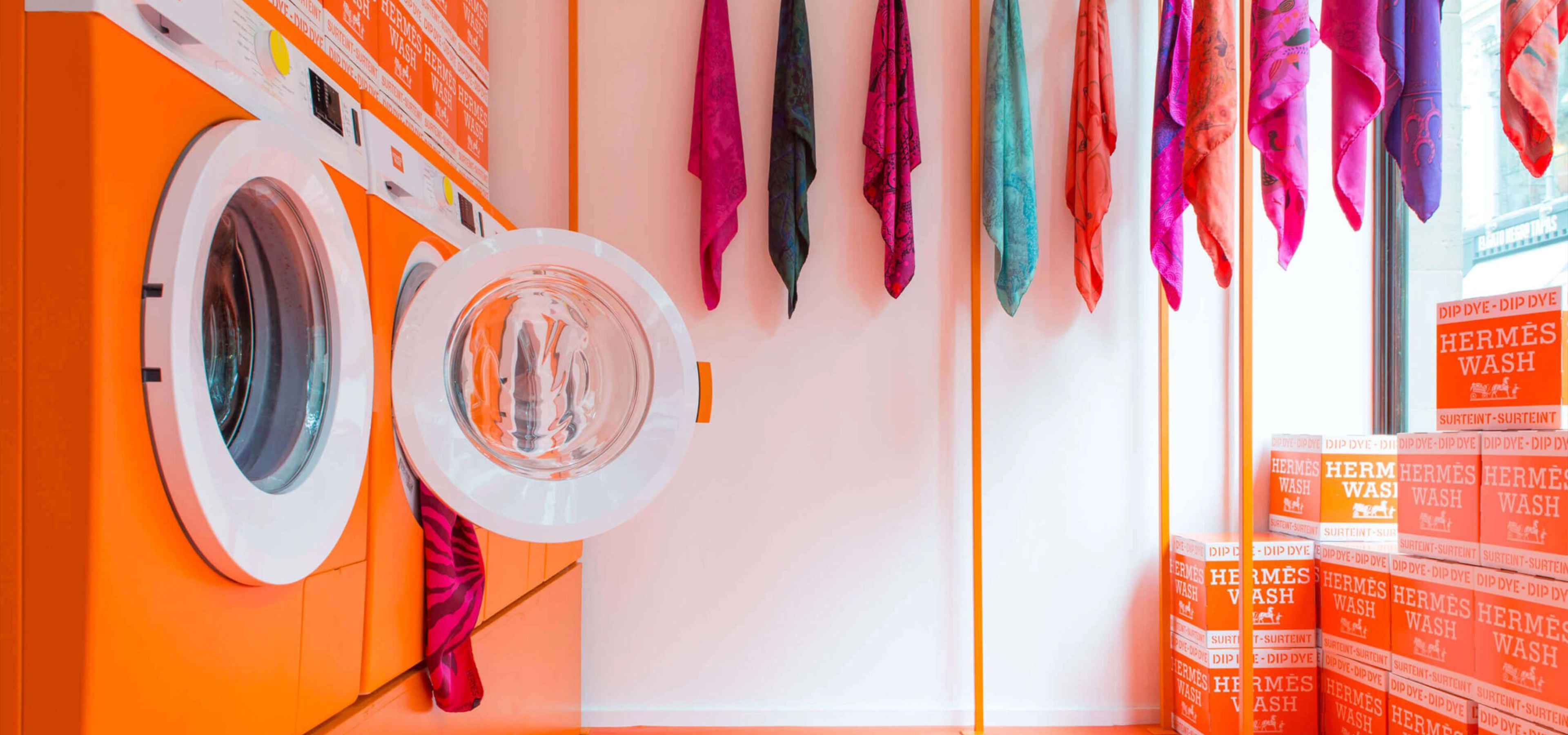 Inside a colourful modern laundrette