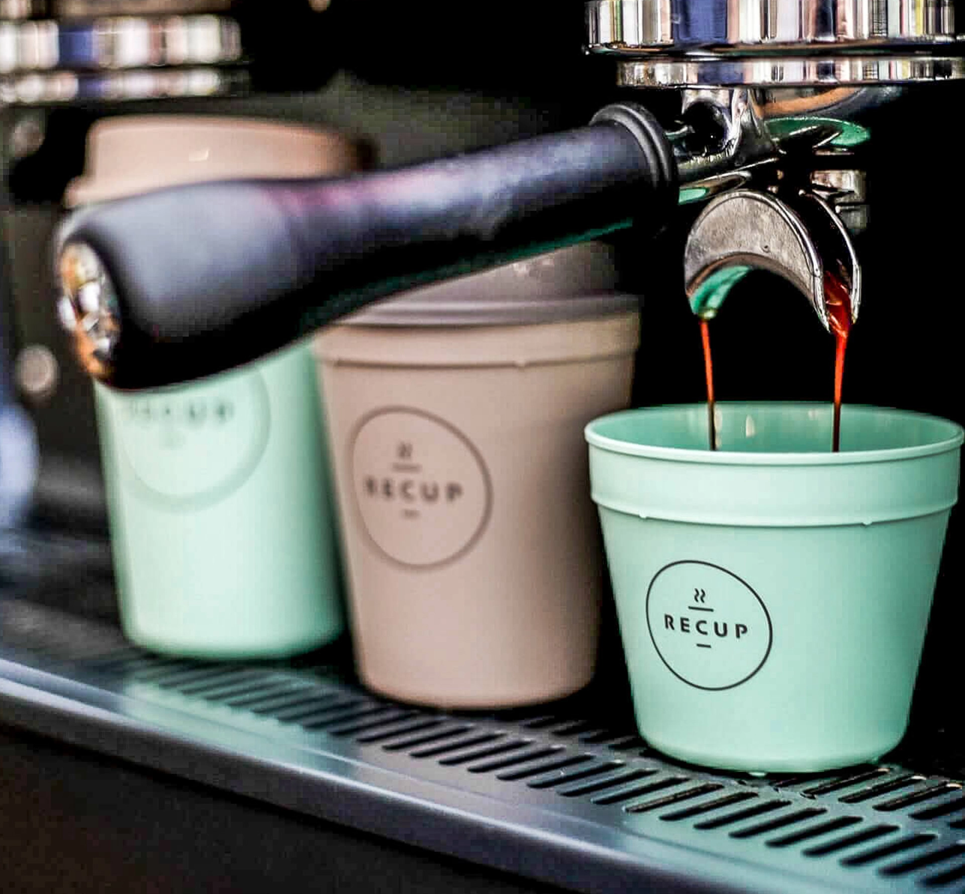 Espresso machine dispensing into reusable cups
