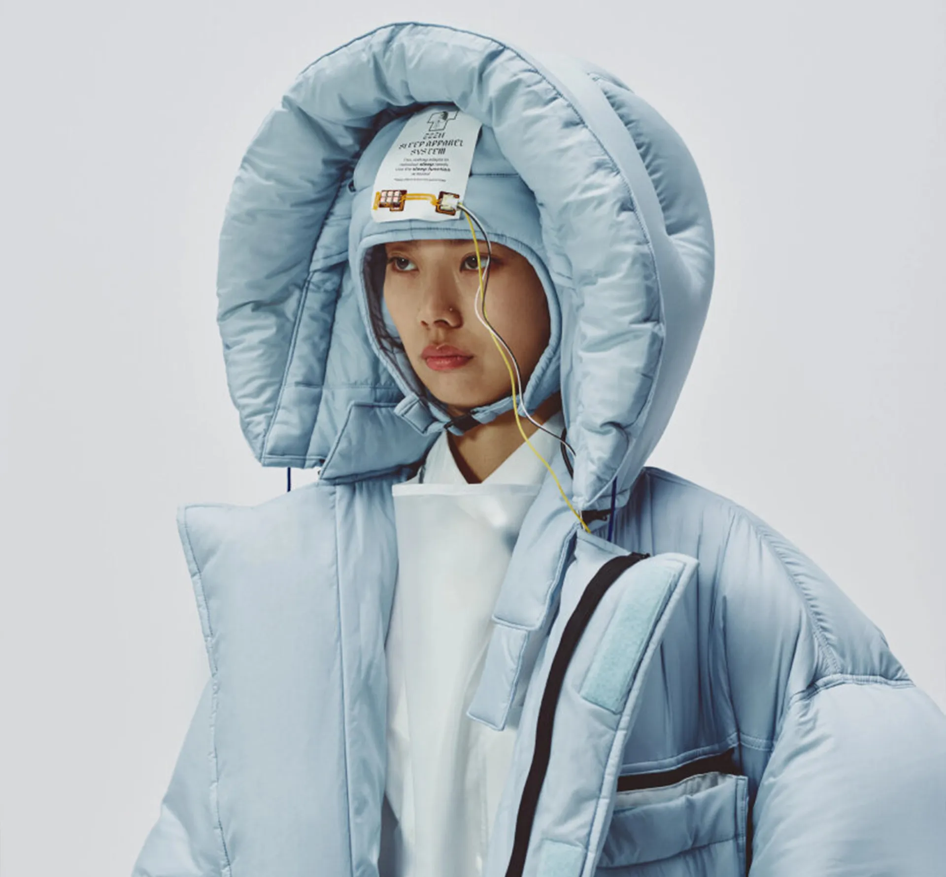 A person in blue duvet jacket
