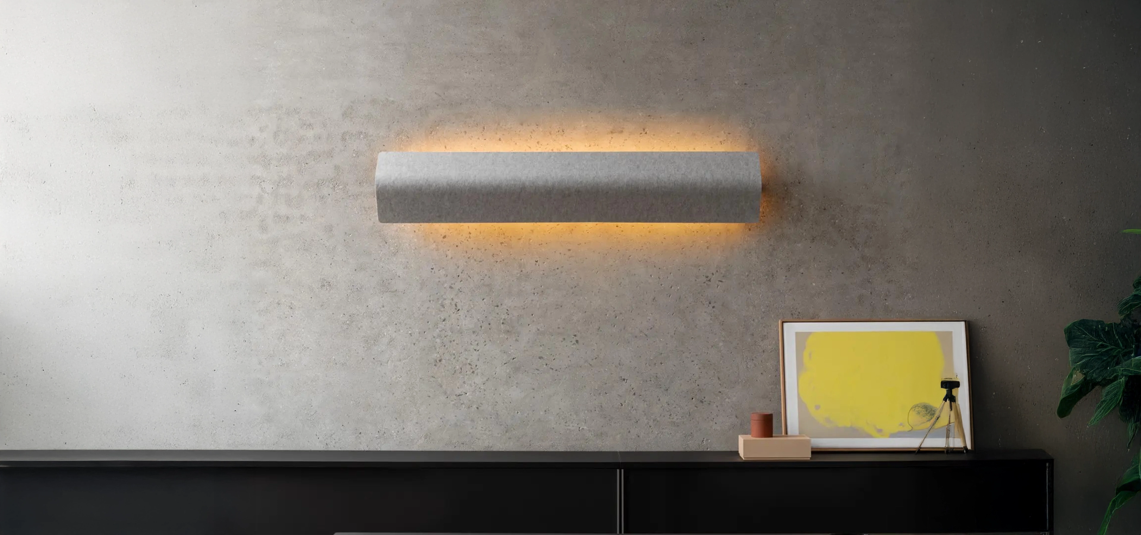 Light illuminating against a grey wall