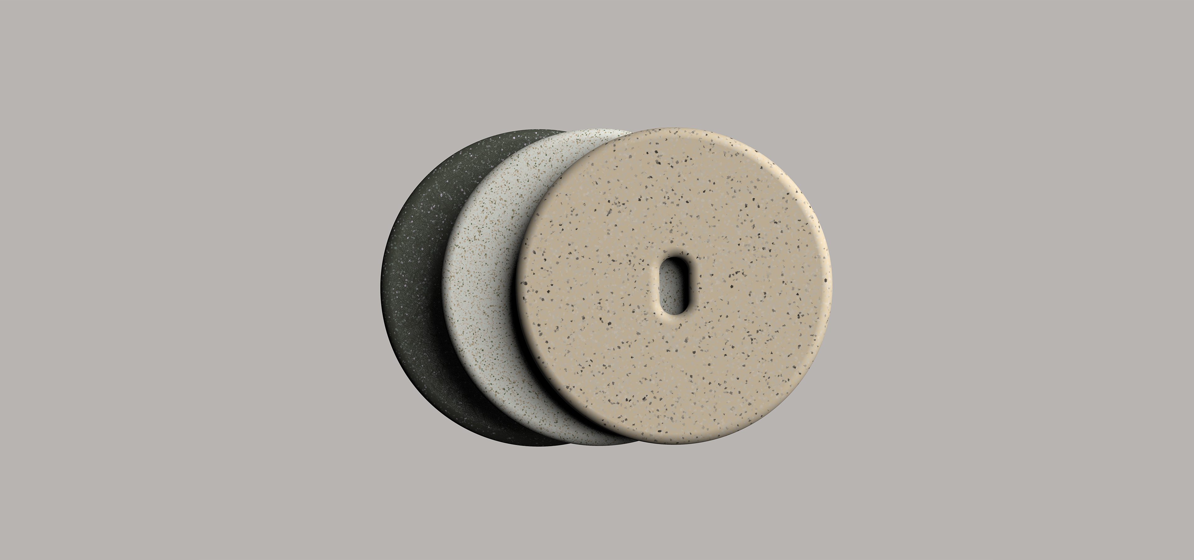 3 soap pucks on a grey background