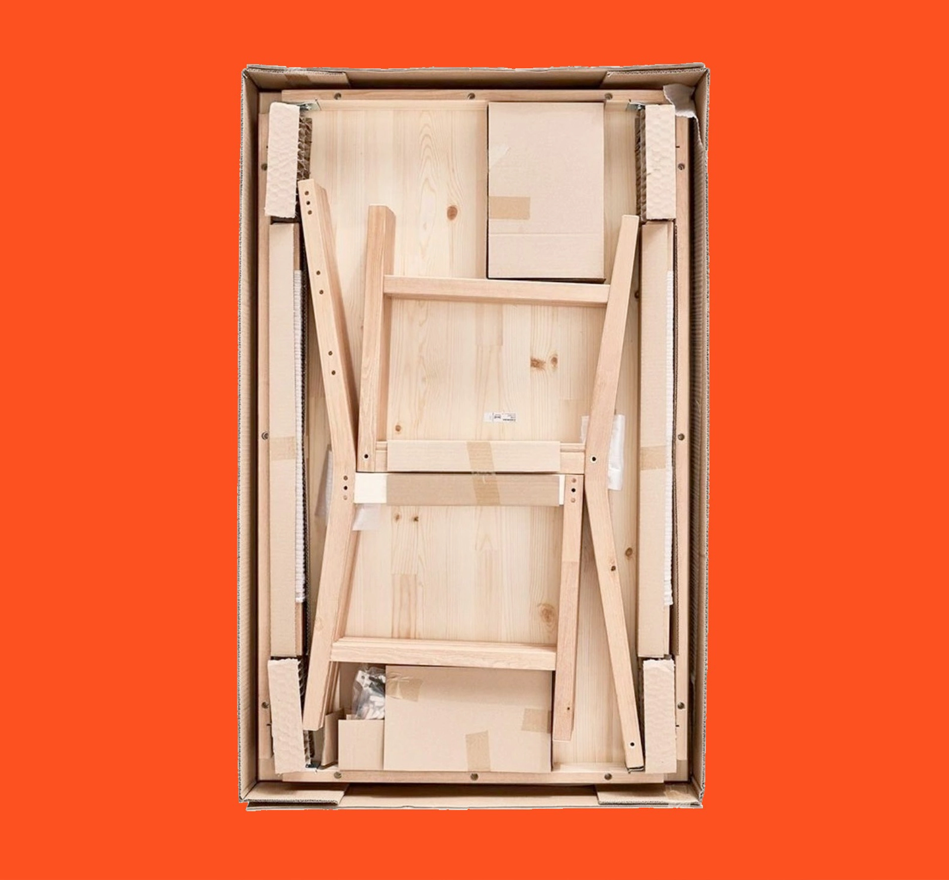 Ikea flatpack furniture on bright orange background