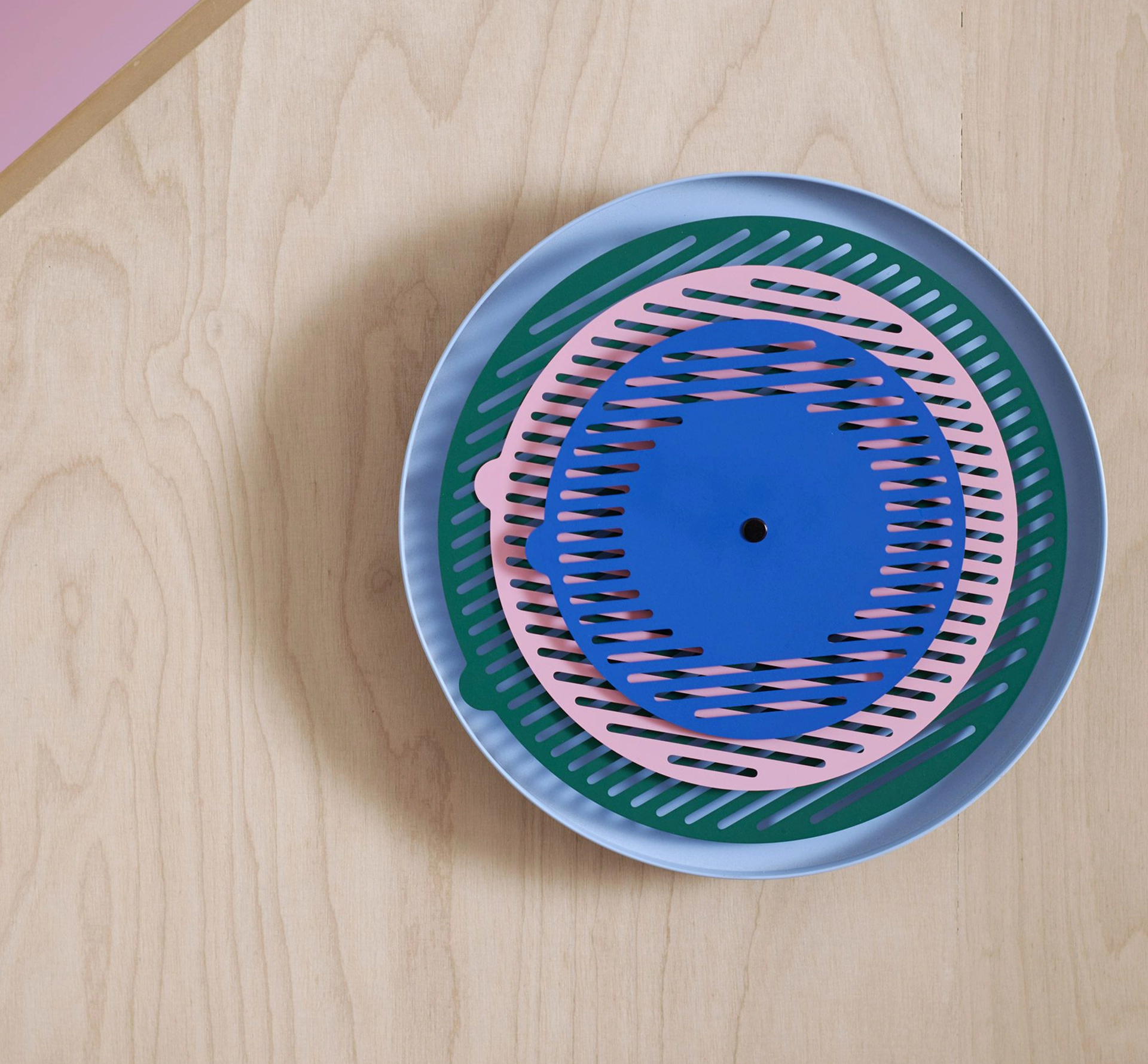 Slotted crockery on a wooden background
