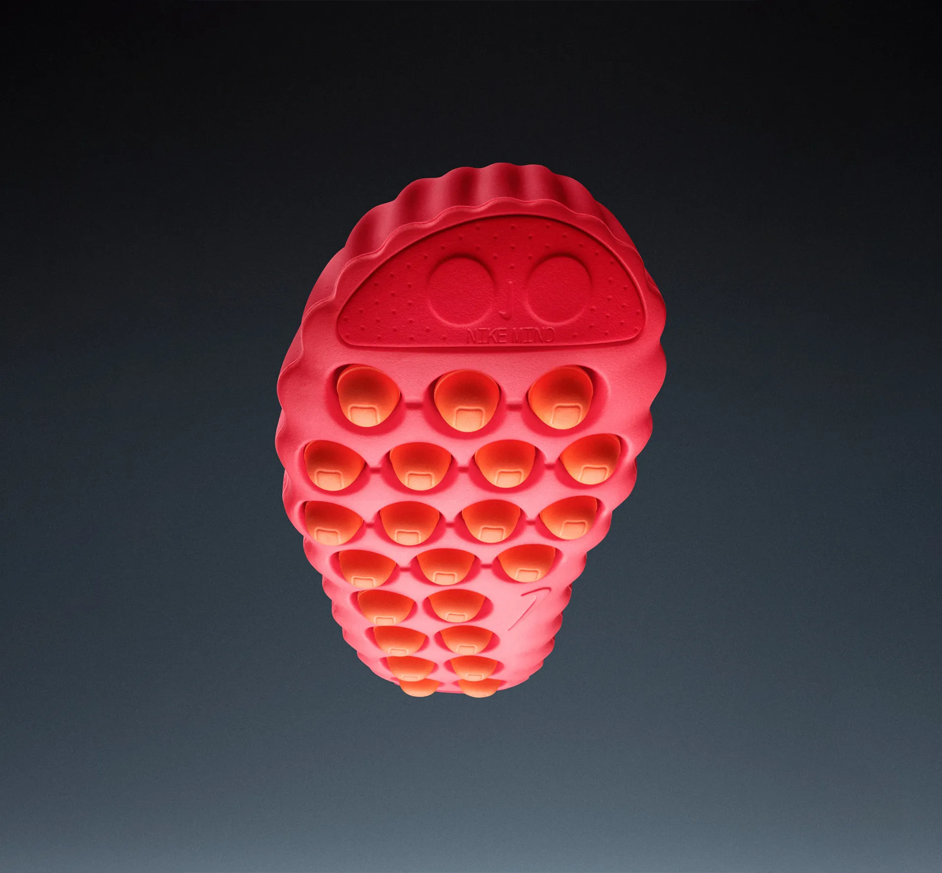 Underside of a Nike shoe in red with orange balls for soles